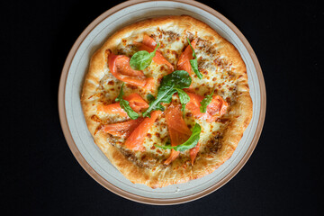 Salmon Pizza Culinary Delight: A close-up shot showcases a delectable salmon pizza artfully presented, with vibrant ingredients that promise a tantalizing experience.