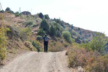 Fototapeta premium A traveler in nature. A man on the mountains.