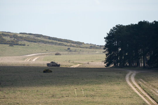 British army Warrior FV510 IFV tanks in action on a battle exercise