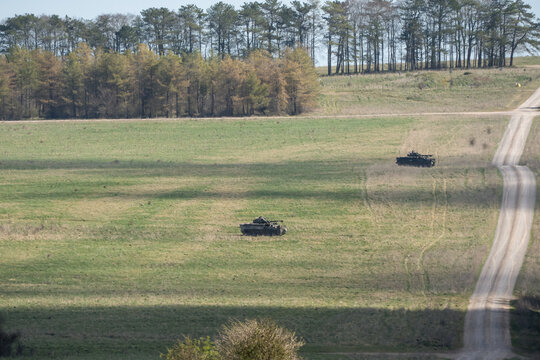 British army Warrior FV510 IFV tanks in action on a battle exercise