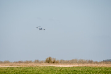 RAF Airbus C.1 A400M Atlas military transport aircraft in flight on a low-level cargo drop run, blue sky