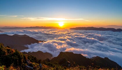 Obraz premium Mountain sunset over clouds (1)