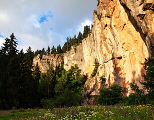 Dramatic mountain face bathed in sunlight