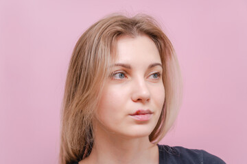 Fototapeta premium Young woman with virus herpes on lips against pink background. Herpes blisters