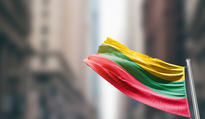 Lithuania  national flag waving on street. A beautiful with mast with blur buildings. Lithuania...