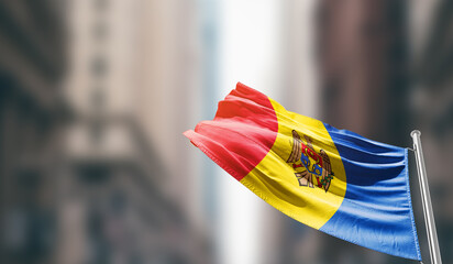 Moldova national flag waving on street. A beautiful with mast with blur buildings. Moldova national...