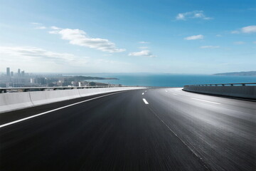 Fototapeta premium Smooth highway with city and sea view in the distance