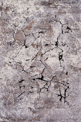 A close-up photo of an hand-woven decorative wool carpet. Texture of clean brand new rug surface with various shapes and colors as background. Top view.