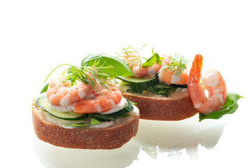 appetizing sandwich with salad and shrimps on a white background