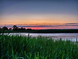 Serene sunset over tranquil river.