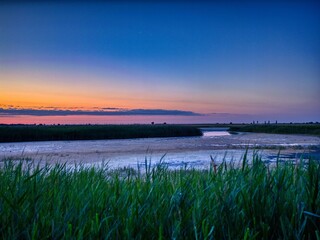 Serene sunset over tranquil marshland