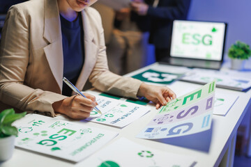 Businesswoman working on esg project in office at night
