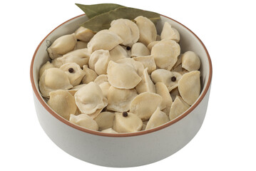 Frozen dumplings semi-finished product piled up decorated with spices in a bowl