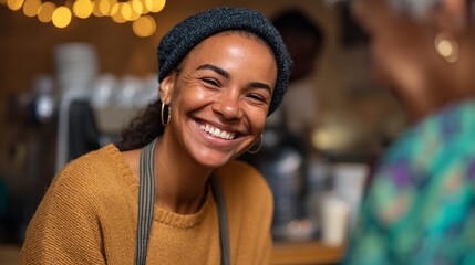 Woman smiling at customer in coffee shop.