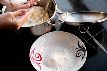 Hands Shaping Syrniki from Dough