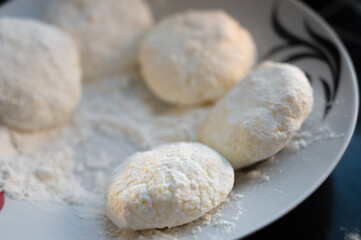 Raw Syrniki Cottage Cheese Dough on White Plate