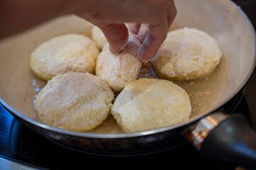 Raw Syrniki Cottage Cheese Pancakes in Frying Pan