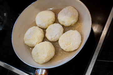 Raw Syrniki Cottage Cheese Pancakes in Frying Pan