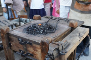 traditional blacksmith handcraft  , coal burning