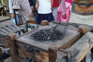 traditional blacksmith handcraft  , coal burning
