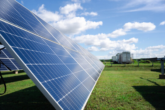 Angled ground-mounted solar panels in open land, built for efficient renewable energy generation with durable framing and long-term outdoor performance