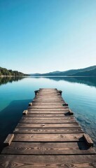 Obraz premium Tranquil scene of a wooden dock extending into calm water, the shore gently sloping into the lake Perfect for relaxation, travel, and nature themes , calm, sunset
