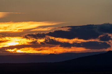 Breathtaking sunset over a mountain landscape with clouds