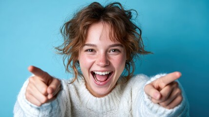 A vibrant image of a joyful woman laughing energetically against a bright blue backdrop, capturing her exuberance and positivity, perfect for conveying happiness and vivacity.