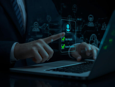 Businessman interacting with futuristic digital interface on a laptop