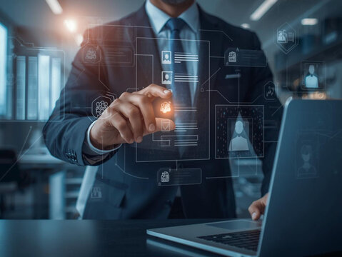 Businessman interacting with futuristic digital interface and laptop