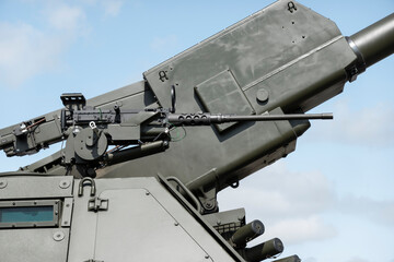 Automatic machine gun on a military armored vehicle
