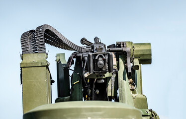 Automatic machine gun on a military armored vehicle