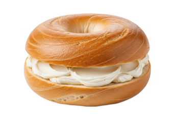 Freshly baked bagel filled with creamy spread, isolated on a clean background for culinary use