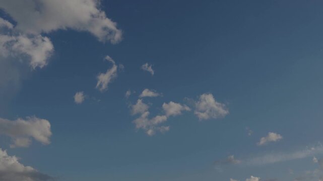 Blue sky with clouds in motion, time lapse