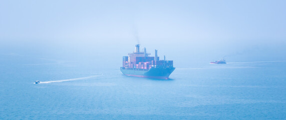 container ship sailing on deep sea, fully loaded with multi-colored containers, reflecting global...