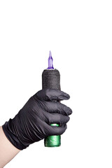 Tattoo machine in Isolivana's hand on a white background