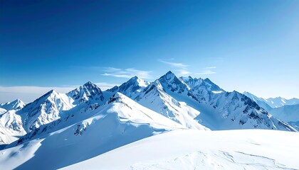 Snowy mountain peaks under a vibrant blue sky