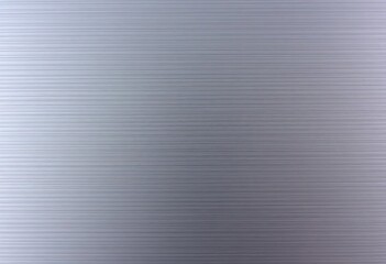 Close-up of brushed silver metallic surface, showing fine linear texture, surface, grey