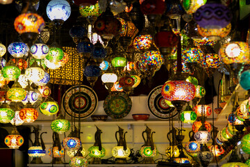 Colorful hanging lanterns in Eastern style displayed at a vibrant market. Perfect for topics on...