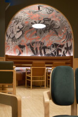 Urban cafe interior with graffiti wall art and modern seating