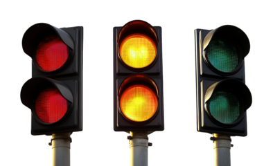 Three traffic lights isolated on transparent background showing red, yellow, and green lights, indicating the different stages of a traffic signal system for vehicles and pedestrians