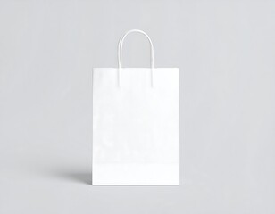 Empty white paper shopping bag against a neutral background