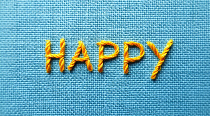 yellow happy text on blue background