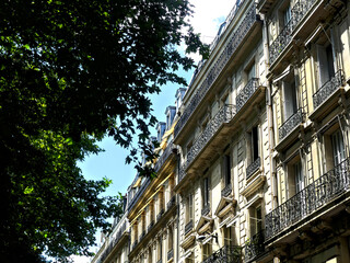 Paris, June 2025 : Visit of the magnificent city of Paris, Capital of France - View on different facades of buildings built by Baron Haussmann