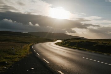 Fototapeta premium Winding road under a sunny sky with clouds
