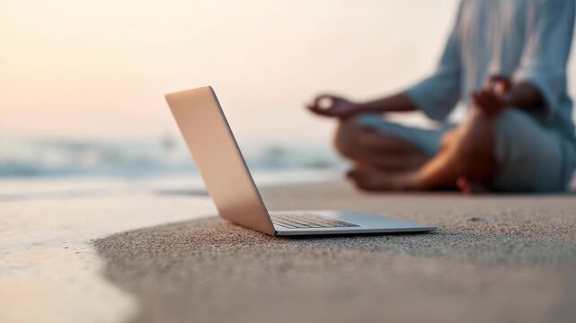 Freelancer enjoying work life balance, practicing mindfulness on a sandy beach with laptop at sunset, combining remote work with travel and personal well being