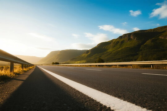 Scenic road with mountains under clear sky during sunset - Powered by Adobe