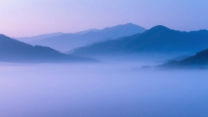 Misty Mountains with Soft Purple Hues in the Early Morning