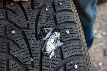Soapy lubrication prevents rubber damage during stud insertion