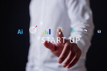 Businessman holding digital tablet with startup icons including AI, target, analytics, innovation, and teamwork, representing technology, entrepreneurship business growth.